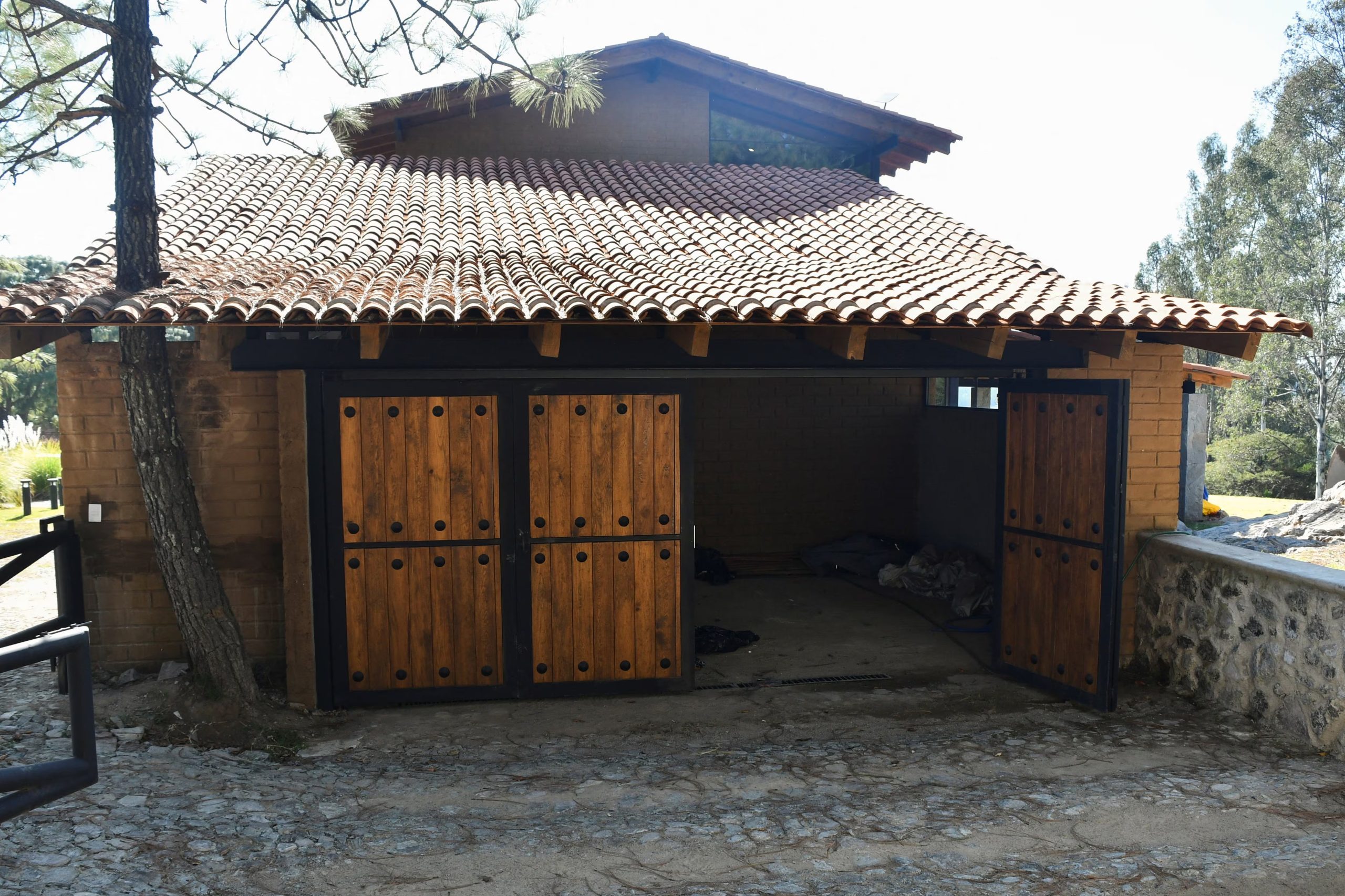 A garage on the property where Mexican drug cartel leader Nemesio Oseguera, better known as 'El Mencho', spent his final hours before he was injured in a military raid and subsequently died while being transported in a helicopter, outside Tapalpa, Mexico, February 24, 2026. REUTERS/Liberto Urena