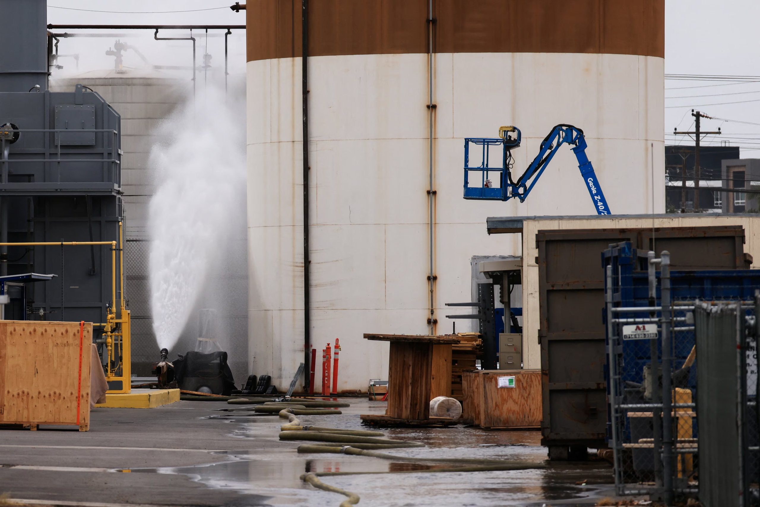 Water is sprayed during a chemical incident involving a leaking tank of methyl methacrylate, a flammable liquid used in the aerospace industry, forcing an evacuation in the surrounding area, in Garden Grove, California, U.S., May 23, 2026. REUTERS/David Swanson