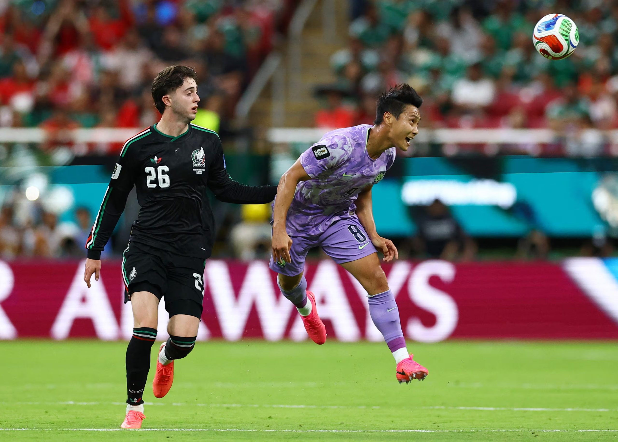 Soccer Football - FIFA World Cup 2026 - Group A - Mexico v South Korea - Estadio Guadalajara, Guadalajara, Mexico - June 18, 2026 South Korea's Paik Seung-ho in action with Mexico's Brian Gutierrez REUTERS/Daniel Becerril