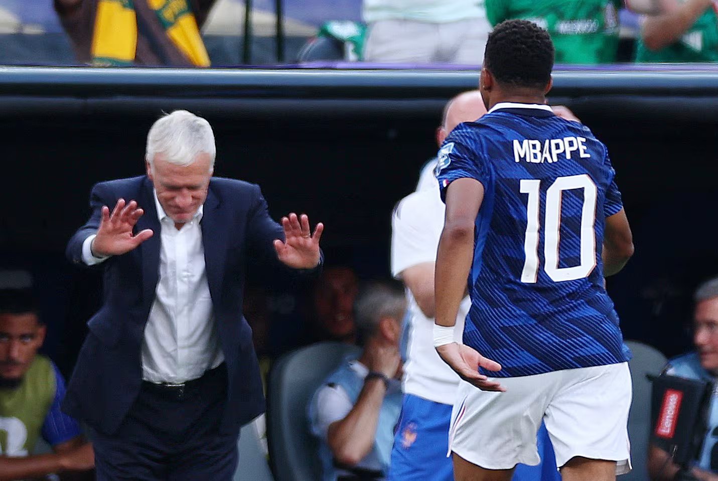 Soccer Football - FIFA World Cup 2026 - Round of 32 - France v Sweden - New York New Jersey Stadium, East Rutherford, New Jersey, U.S. - June 30, 2026 France's Kylian Mbappe with coach Didier Deschamps after being substituted IMAGN IMAGES via Reuters/Vincent Carchietta