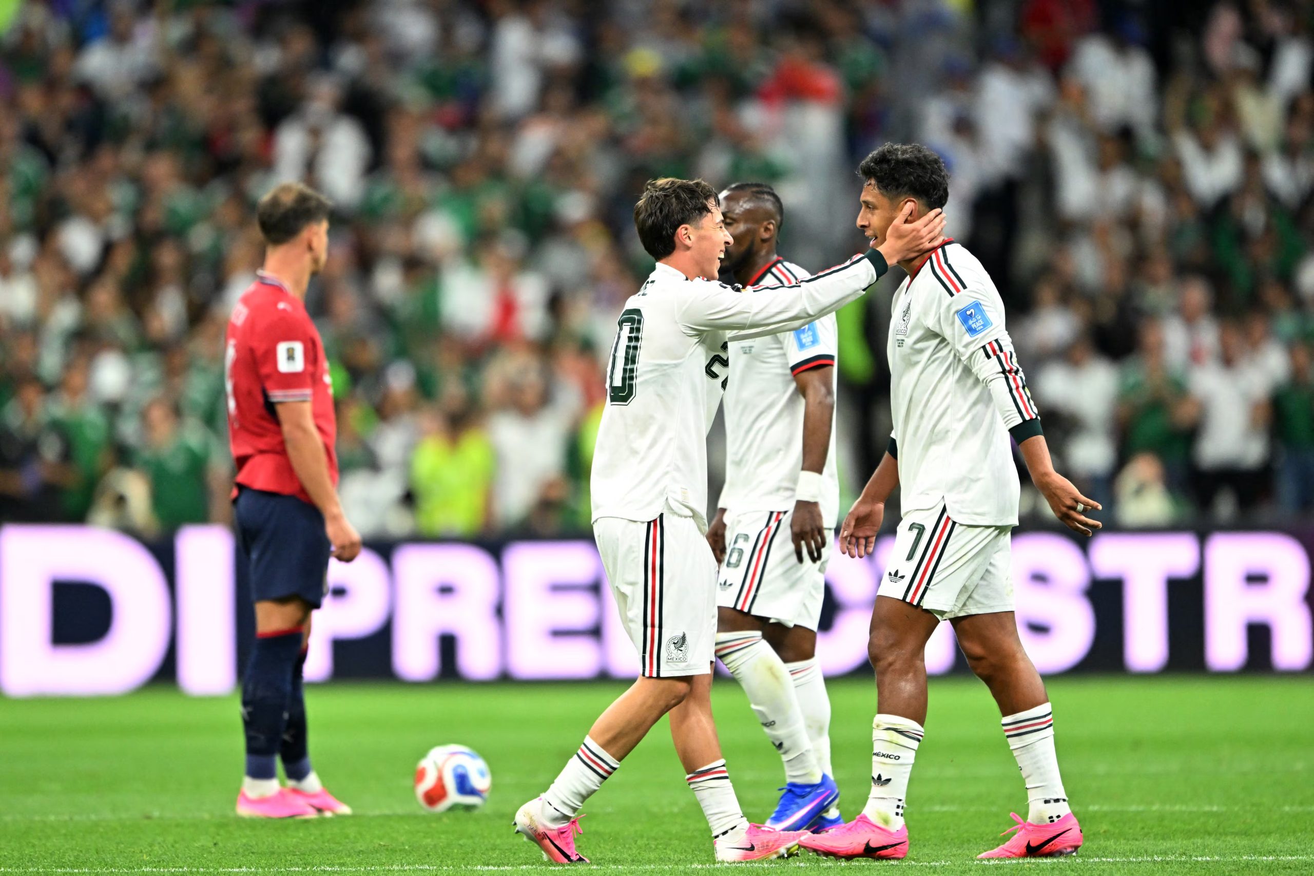 Mexico's defender #20 Mateo Chavez celebrates scoring his team's first goal with teammate midfielder #07 Luis Romo during the 2026 World Cup Group A football match between the Czech Republic and Mexico at the Mexico City Stadium in Mexico City on June 24, 2026. (Photo by CARL DE SOUZA / AFP)