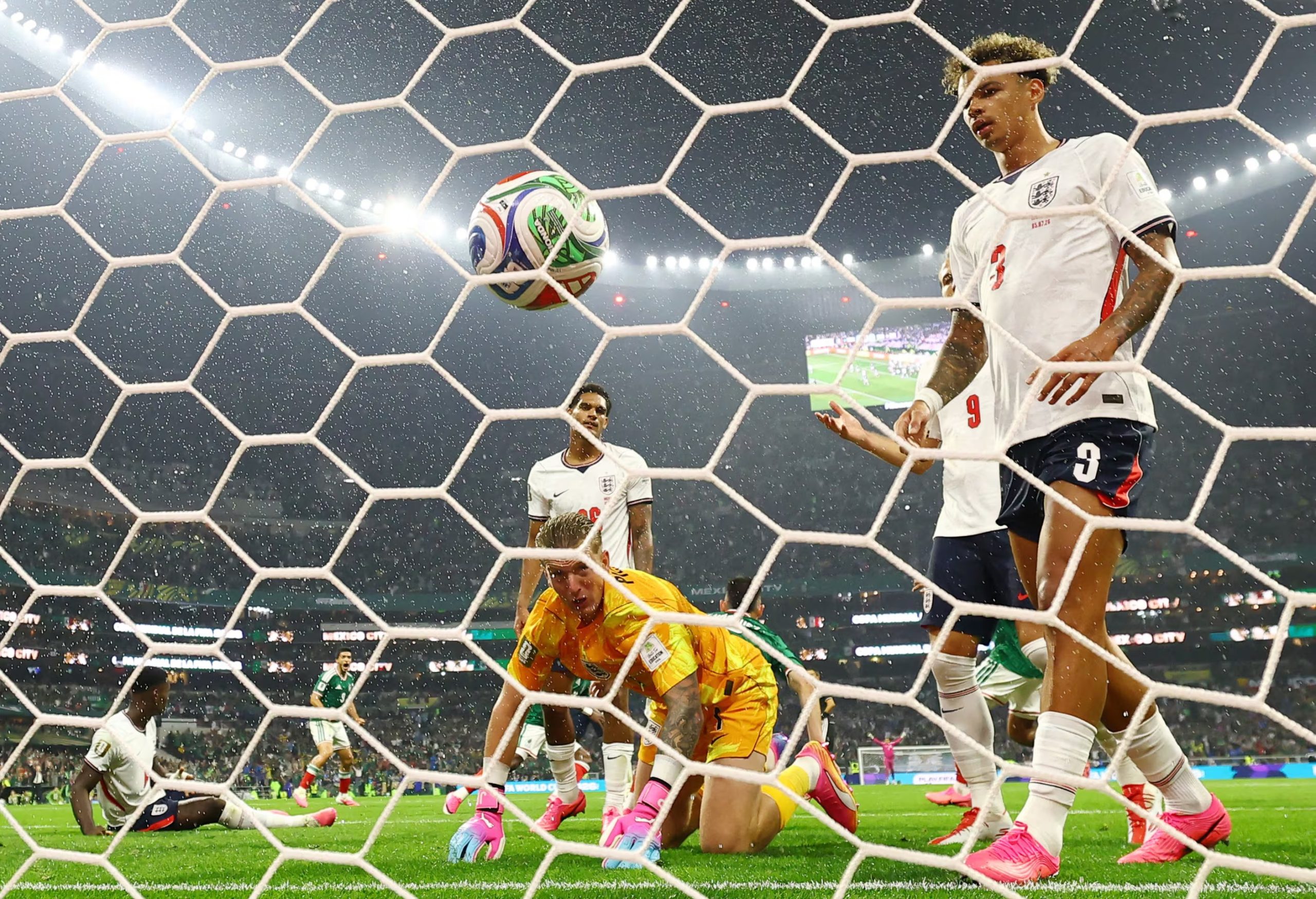 Soccer Football - FIFA World Cup 2026 - Round of 16 - Mexico v England - Estadio Azteca, Mexico City, Mexico - July 5, 2026 England's Jordan Pickford, Nico O'Reilly and Jarell Quansah look dejected after Mexico's Julian Quinones scores their first goal REUTERS/Paul Childs