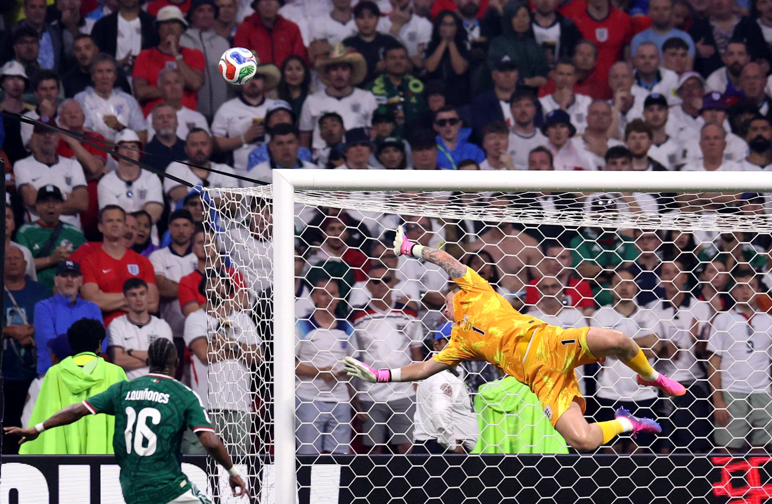 Soccer Football - FIFA World Cup 2026 - Round of 16 - Mexico v England - Estadio Azteca, Mexico City, Mexico - July 5, 2026 England's Jordan Pickford saves a shot by Mexico's Raul Jimenez REUTERS/Raquel Cunha
