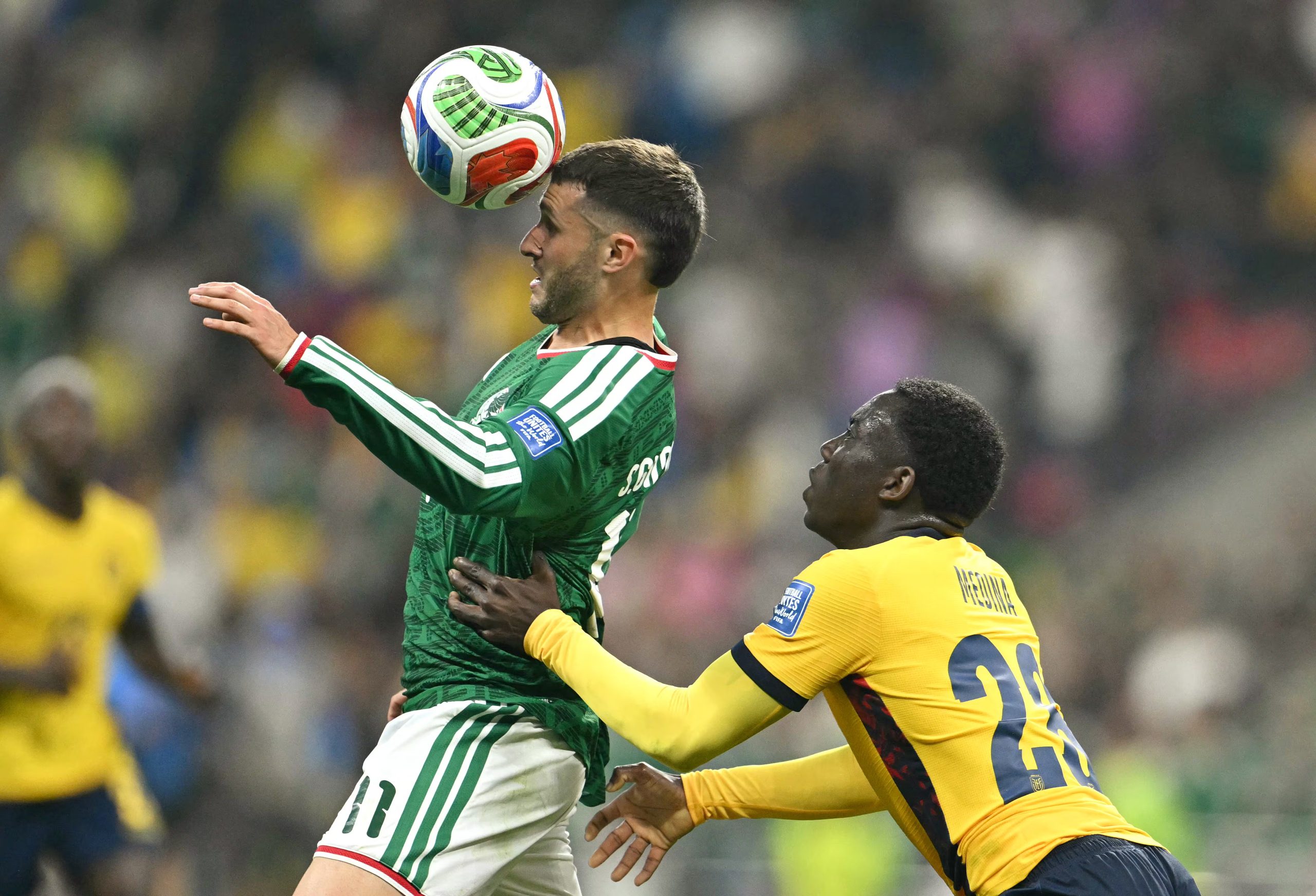 Mexico's forward #11 Santiago Gimenez and Ecuador's midfielder #23 Moises Caicedo fight for the ball during the 2026 World Cup round of 32 football match between Mexico and Ecuador at the Mexico City Stadium in Mexico City on June 30, 2026. (Photo by Yuri CORTEZ / AFP)