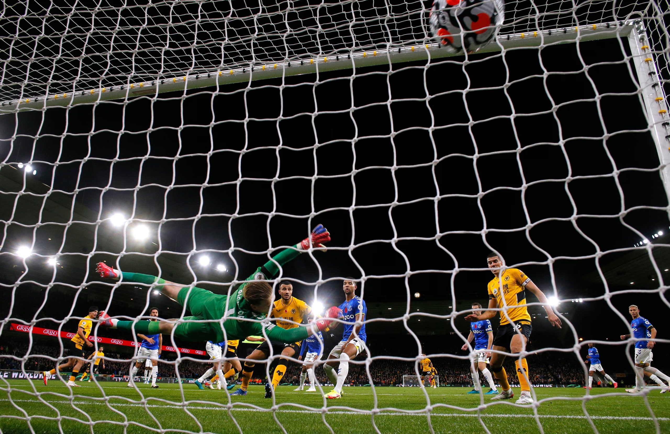 Soccer Football - Premier League - Wolverhampton Wanderers v Everton - Molineux Stadium, Wolverhampton, Britain - November 1, 2021 Wolverhampton Wanderers' Raul Jimenez scores their second goal past Everton's Jordan Pickford Action Images via Reuters/Andrew Couldridge EDITORIAL USE ONLY. No use with unauthorized audio, video, data, fixture lists, club/league logos or 'live' services. Online in-match use limited to 75 images, no video emulation. No use in betting, games or single club /league/player publications. Please contact your account representative for further details.