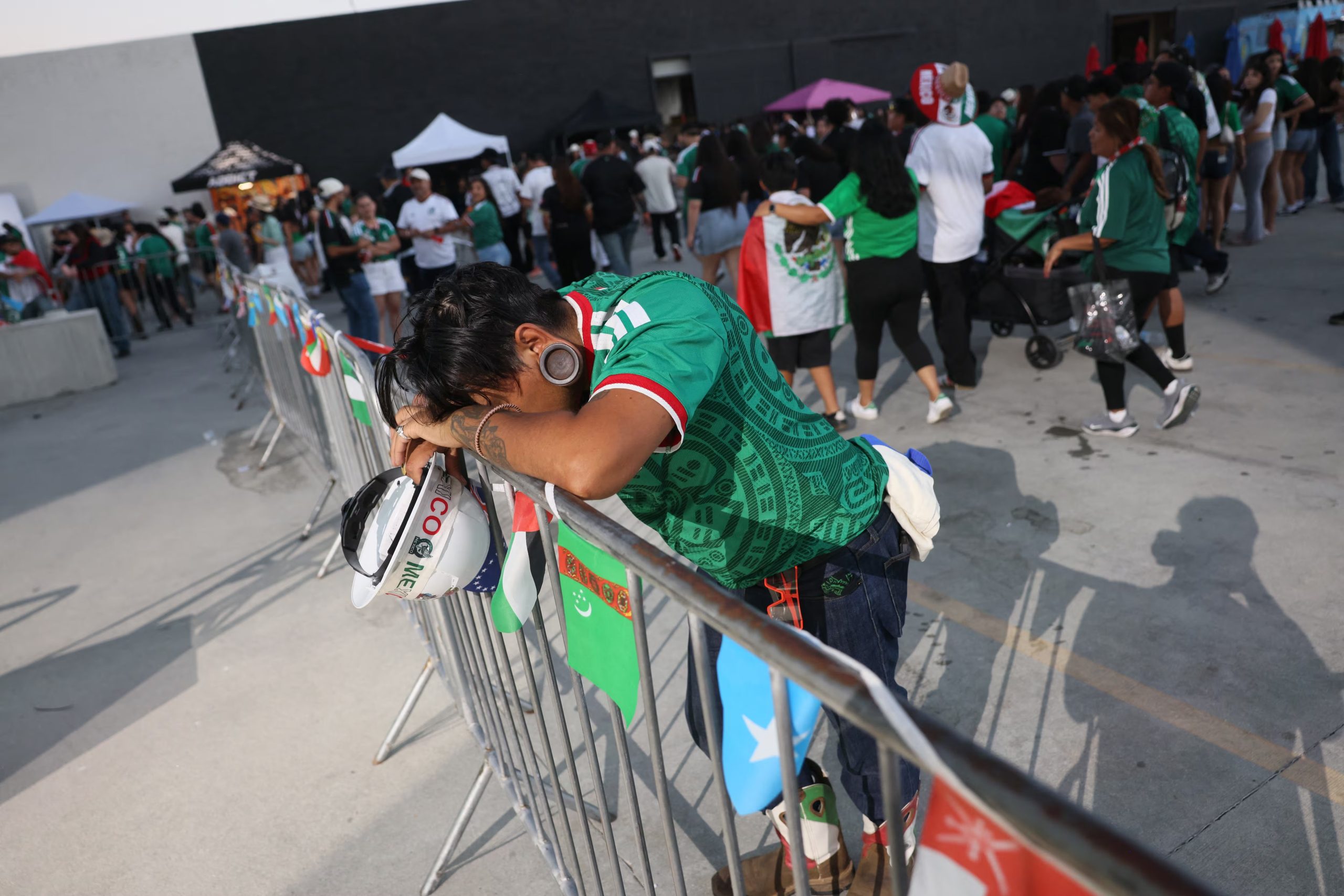 A Mexico fan reacts after their team lost the 2026 World Cup round of 16 football match between the Mexico and England, at a watch party at Ace Mission Studios, in Los Angeles, California, on July 5, 2026. (Photo by Etienne Laurent / AFP)