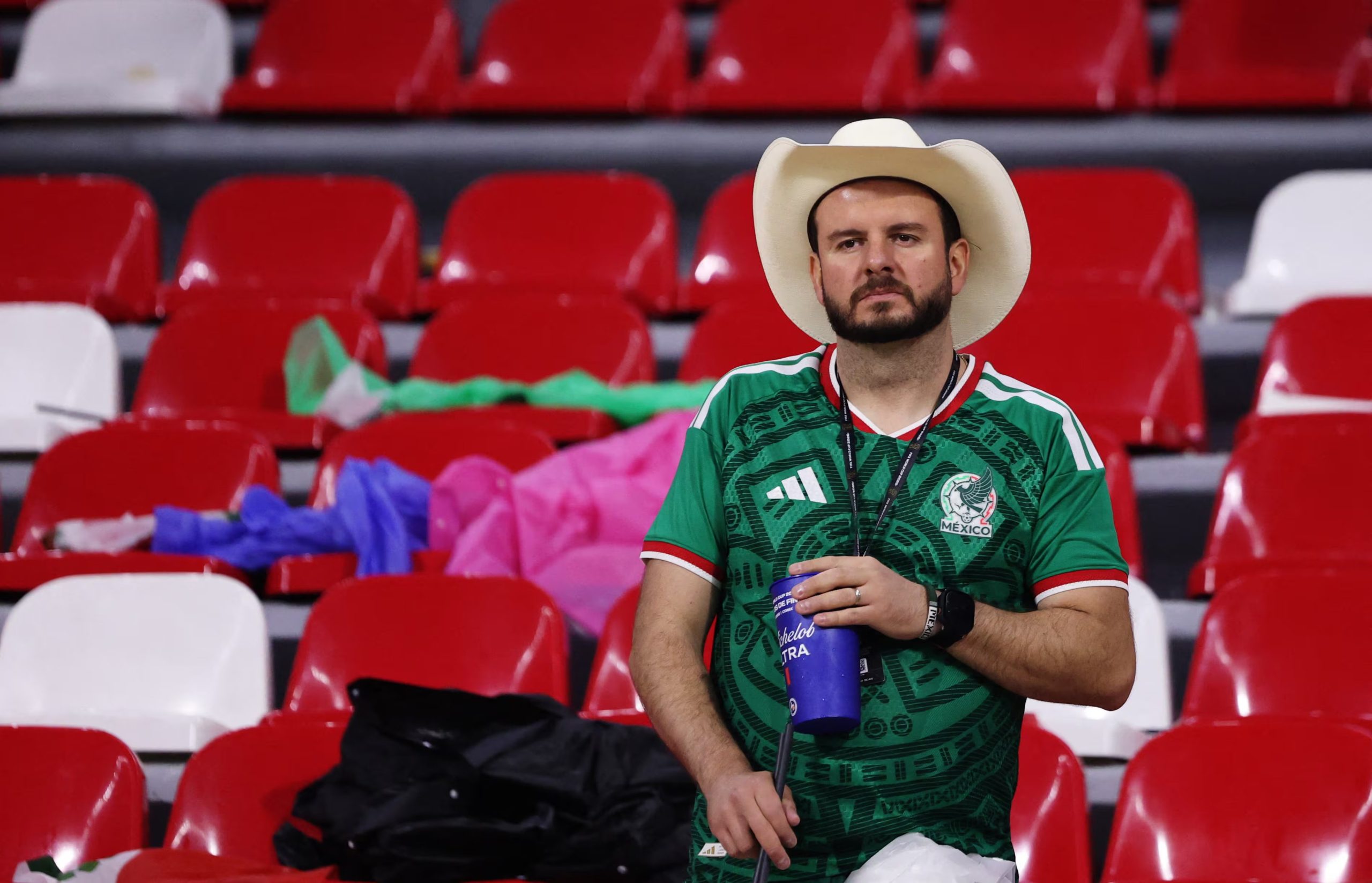 Soccer Football - FIFA World Cup 2026 - Round of 16 - Mexico v England - Estadio Azteca, Mexico City, Mexico - July 5, 2026 A Mexico fan in the empty stands as he looks dejected after the match REUTERS/Raquel Cunha
