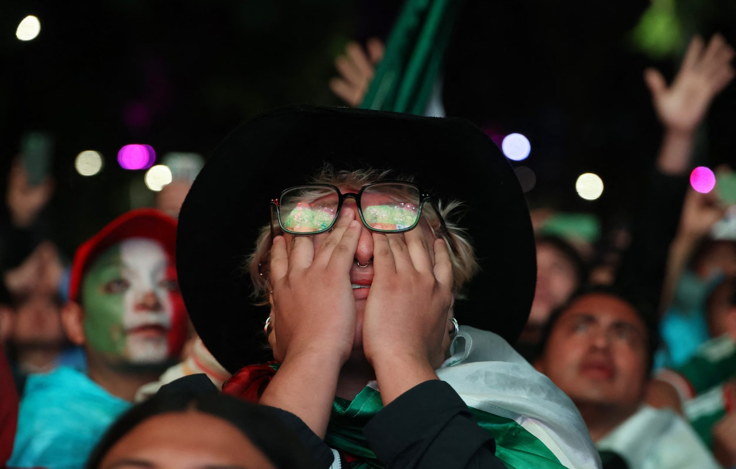 Soccer Football - FIFA World Cup 2026 - Round of 16 - Mexico v England - Fans gather in Mexico City - Mexico City, Mexico - July 5, 2026 A Mexico fan reacts as they watch the match on a big screen in Mexico City REUTERS/Luis Cortes