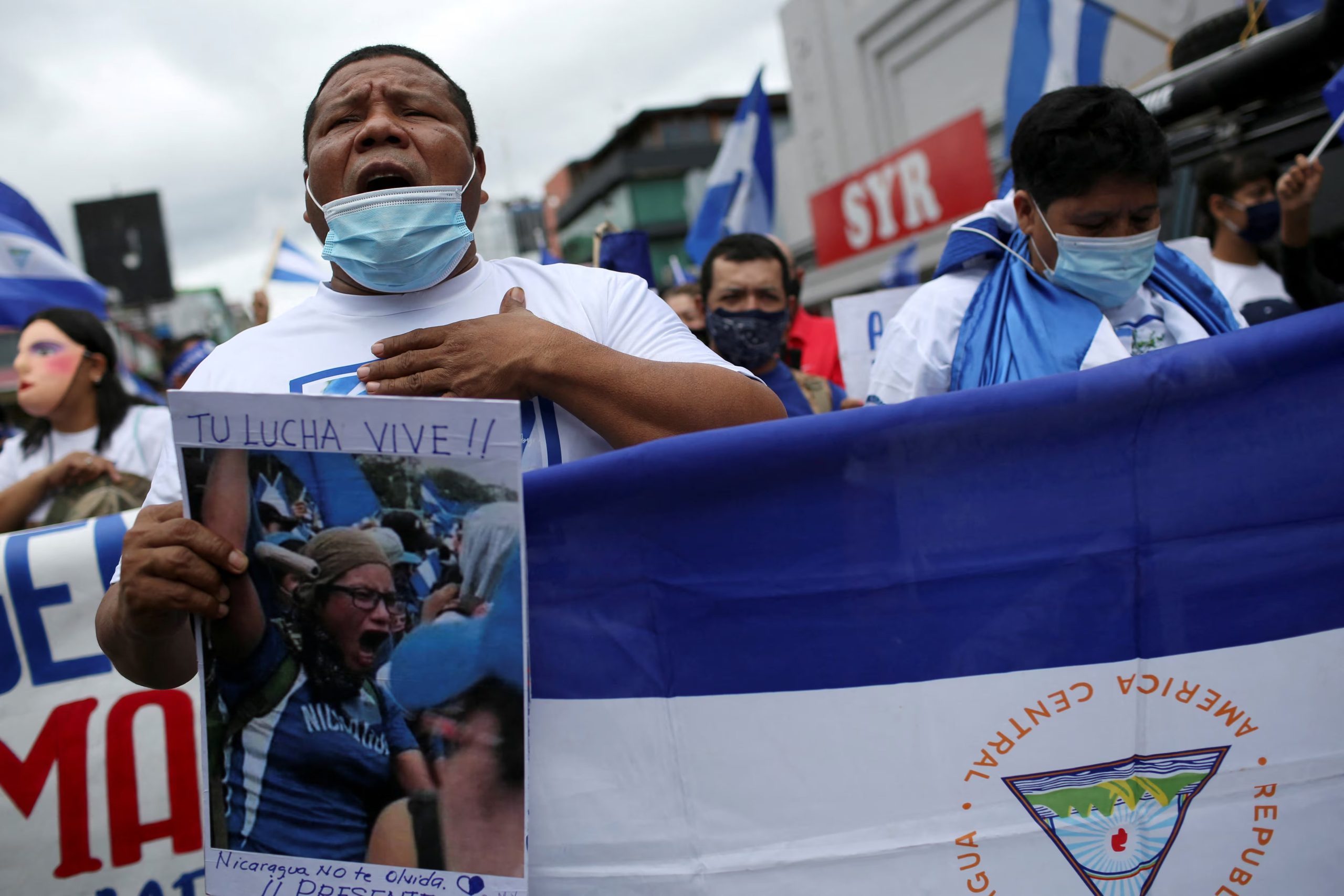 FILE PHOTO: A man sings Nicaragua's national anthem during a march of Nicaraguans exiled in Costa Rica to protest against the presidential election in Nicaragua, in San Jose, Costa Rica November 7, 2021. REUTERS/Mayela Lopez/File Photo