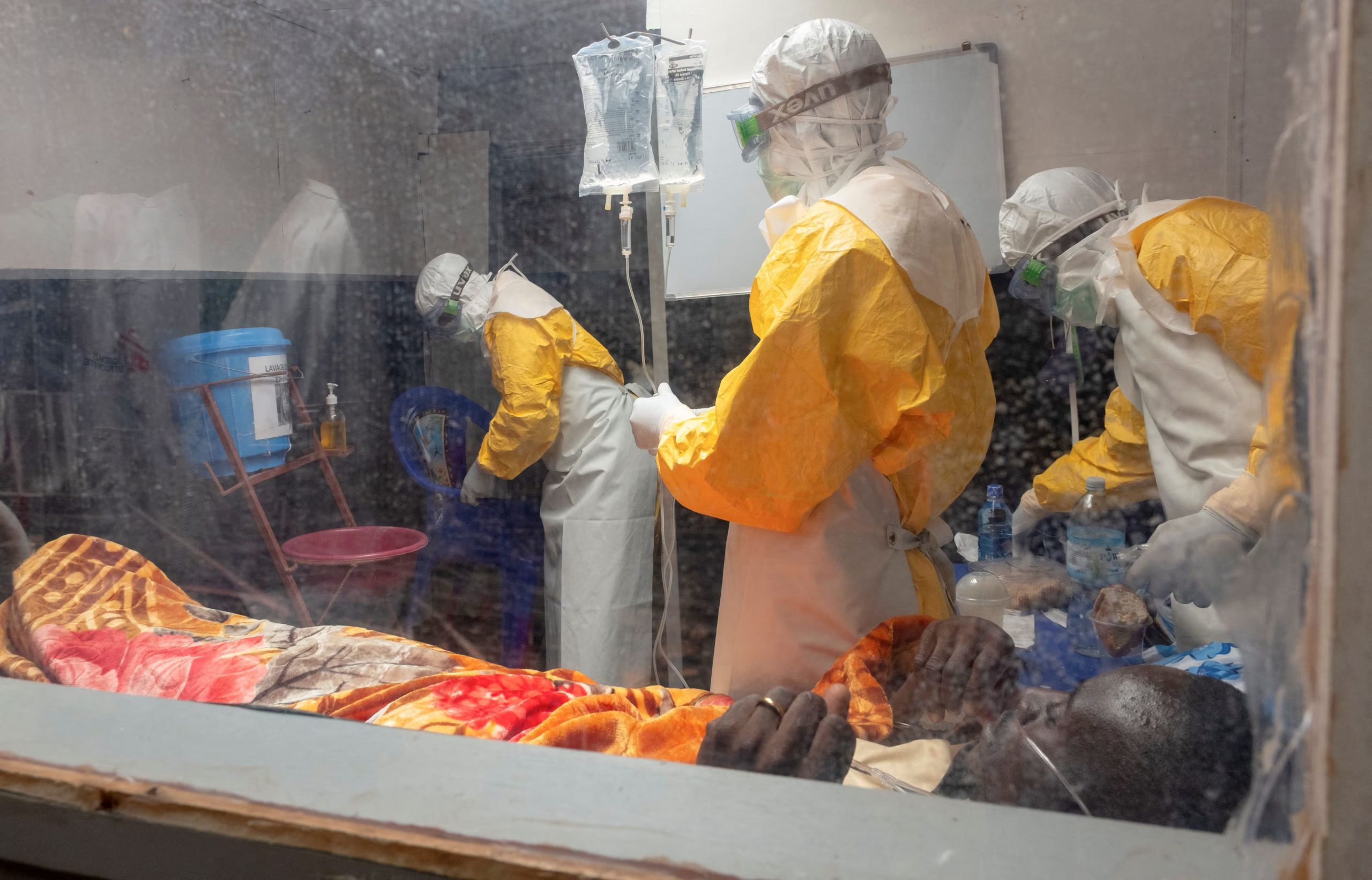 Medecins Sans Frontieres (MSF) doctors treat a patient inside the Kitatumba Ebola treatment center, as aid agencies intensify efforts to contain a new Ebola outbreak involving the Bundibugyo species, in Butembo, North Kivu province, Democratic Republic of Congo, September 23, 2026. REUTERS/Gradel Muyisa Mumbere