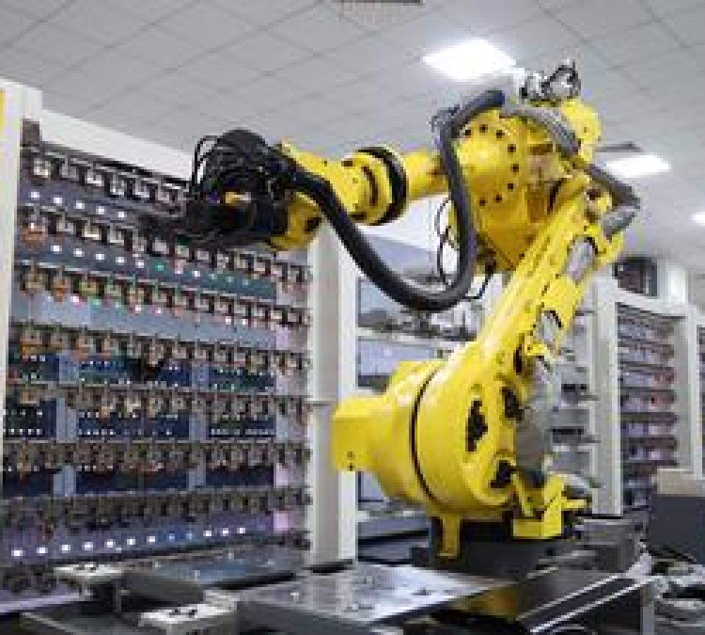 (260702) -- DONGGUAN, July 2, 2026 (Xinhua) -- An industrial robot operates in a digital workshop at Dongguan Moldbao Smart Technology Co. in Dongguan, south China's Guangdong Province, July 2, 2026. Dongguan Moldbao Smart Technology Co. specializes in the research, development and production of precision molds for smart hardware, designer toys and other products. By integrating artificial intelligence, industrial internet and smart manufacturing technologies, the company has built a highly automated workshop for mold manufacturing and injection molding, which boasts a 90 percent automation level and improves production efficiency by 30 percent. (Xinhua/Liang Xu)